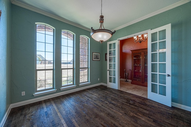 166 Cactus Dr, Decatur, TX 76234 - unfurnished room with a healthy amount of sunlight, french doors, and wood finished floors