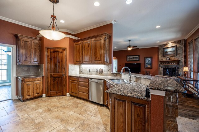 166 Cactus Dr, Decatur, TX 76234 - kitchen featuring ceiling fan, a sink, a peninsula, backsplash, and stainless steel dishwasher