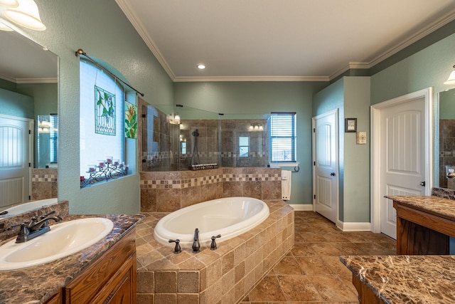 bathroom featuring vanity, ornamental molding, and independent shower and bath