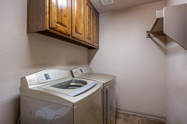166 Cactus Dr, Decatur, TX 76234 - clothes washing area with visible vents, cabinet space, and washing machine and clothes dryer