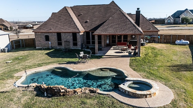 166 Cactus Dr, Decatur, TX 76234 - back of property with a lawn, brick siding, a chimney, and a fenced backyard