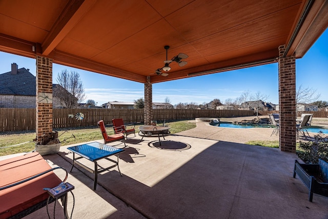 166 Cactus Dr, Decatur, TX 76234 - view of patio with a fenced in pool, a fenced backyard, a ceiling fan, and a fire pit