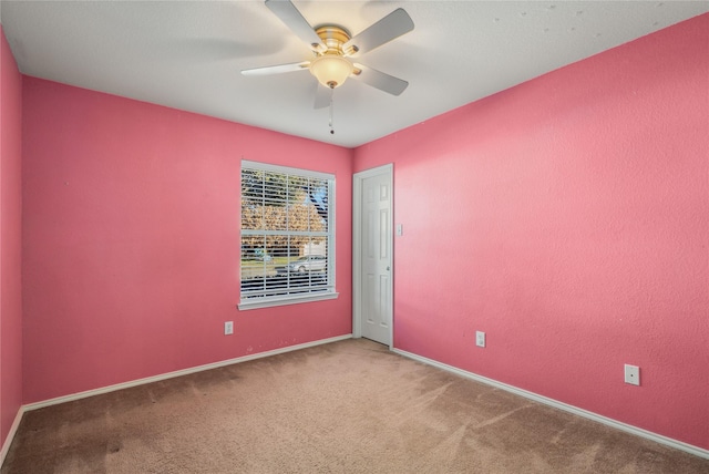 unfurnished room featuring carpet flooring and ceiling fan