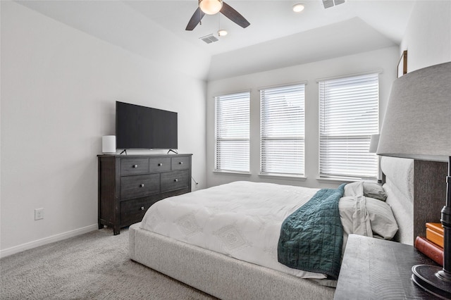 bedroom featuring ceiling fan, vaulted ceiling, and light carpet