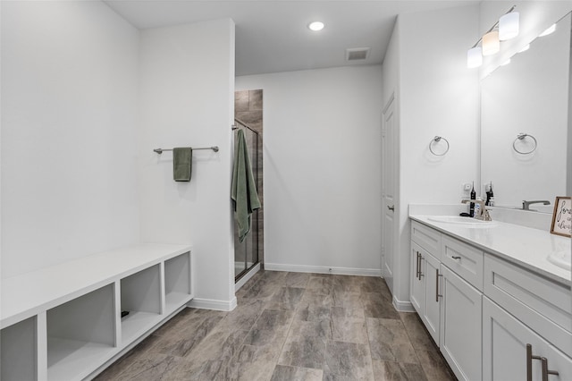 bathroom featuring vanity and walk in shower