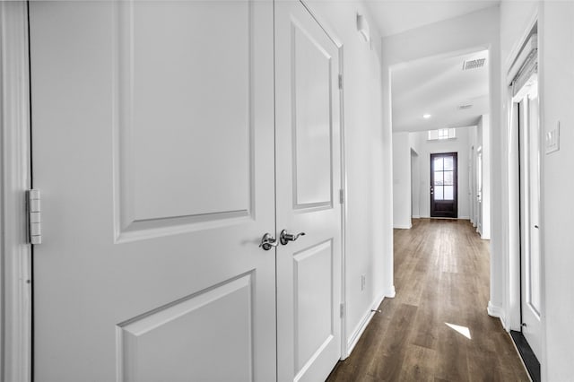 hall with dark wood-type flooring