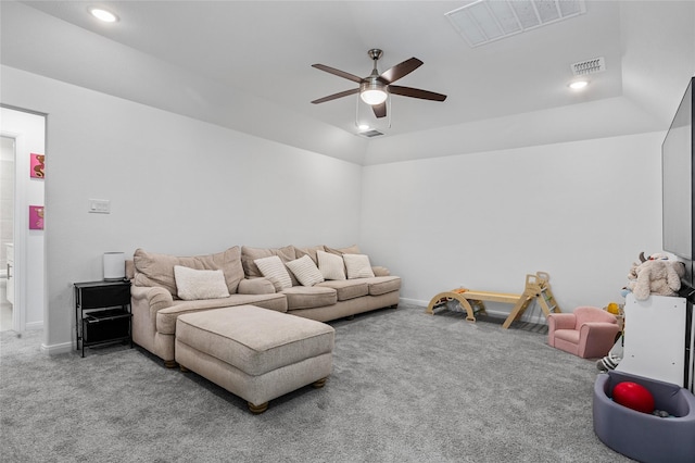 living room with vaulted ceiling, ceiling fan, and carpet flooring