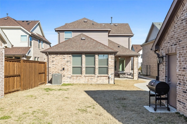 back of house featuring central AC unit and a patio area