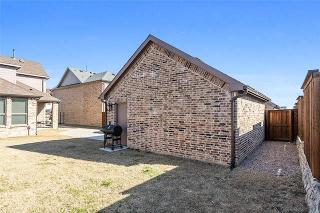 view of side of property with a patio