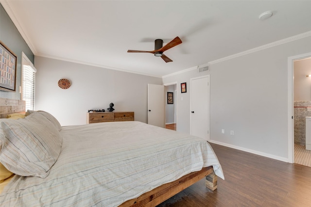 bedroom featuring crown molding, ensuite bath, dark hardwood / wood-style floors, and ceiling fan