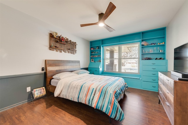 bedroom with ceiling fan and dark hardwood / wood-style flooring