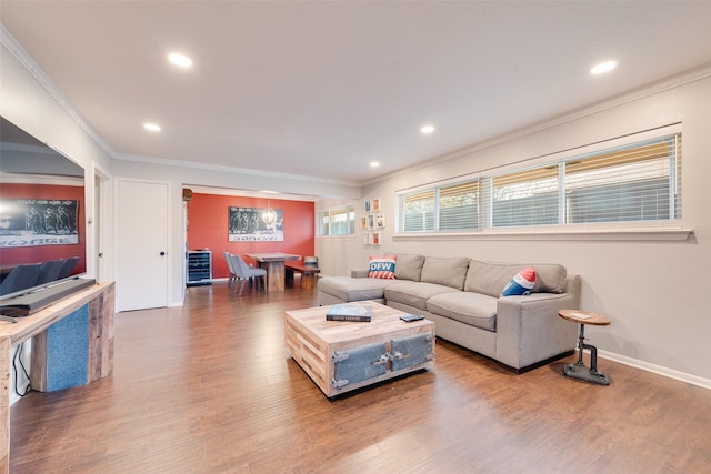 living room featuring crown molding and hardwood / wood-style floors