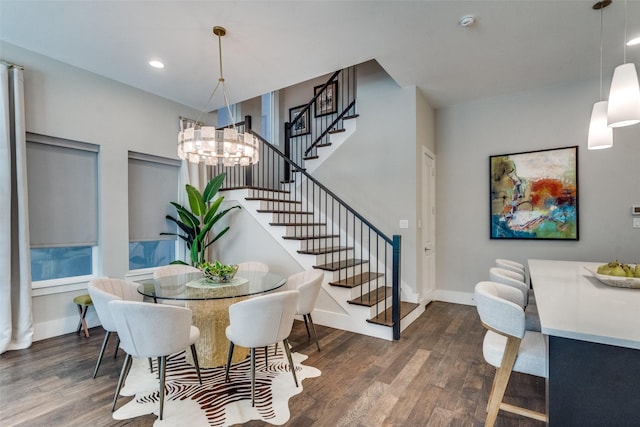 dining room with an inviting chandelier and dark hardwood / wood-style floors