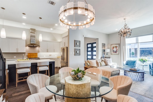 dining room featuring dark wood-type flooring and a chandelier