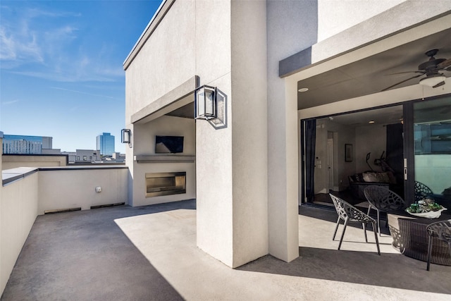 view of patio featuring ceiling fan