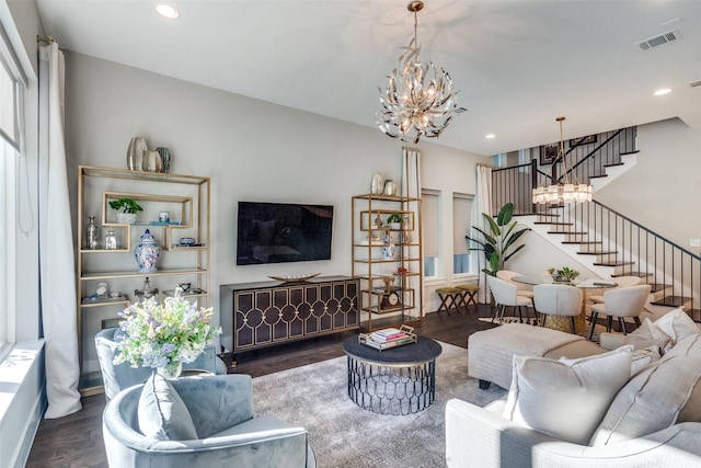 living room featuring dark hardwood / wood-style flooring and a chandelier