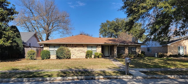 ranch-style house with a front yard