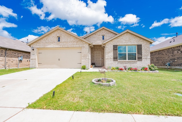 view of front of property featuring a garage and a front lawn