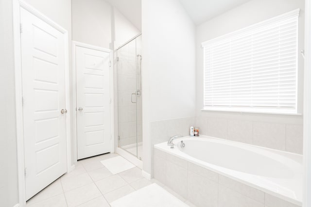 bathroom with separate shower and tub and tile patterned floors