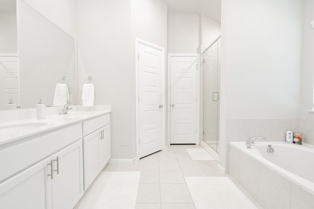 bathroom with vanity, tile patterned floors, and shower with separate bathtub