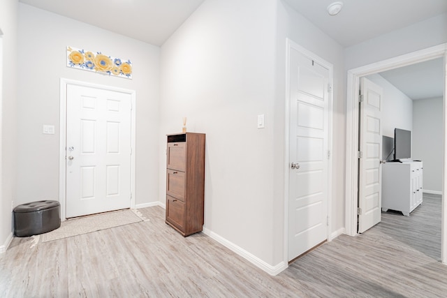 entryway with light hardwood / wood-style flooring