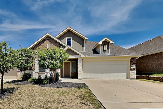 craftsman-style home with a garage and a front lawn