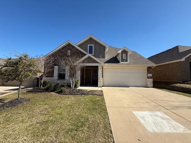 view of front of home featuring a garage and a front lawn