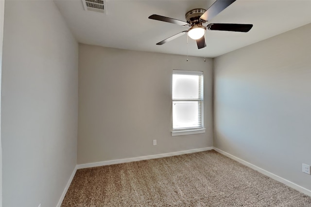 carpeted spare room with ceiling fan