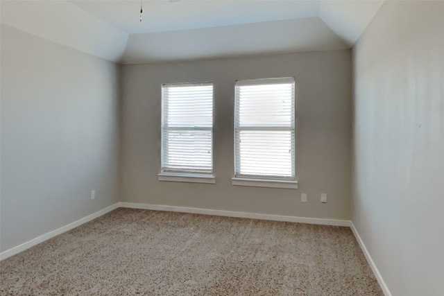 empty room with vaulted ceiling and ceiling fan