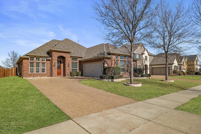 view of front of property featuring a garage and a front yard