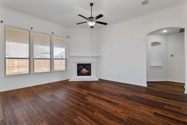 unfurnished living room with ornamental molding, dark hardwood / wood-style floors, and ceiling fan