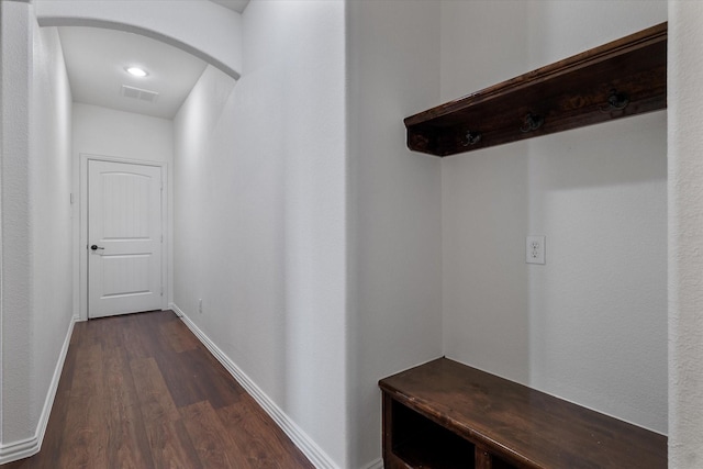 corridor with dark wood-type flooring