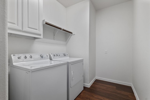 laundry area with cabinets, separate washer and dryer, and dark hardwood / wood-style flooring