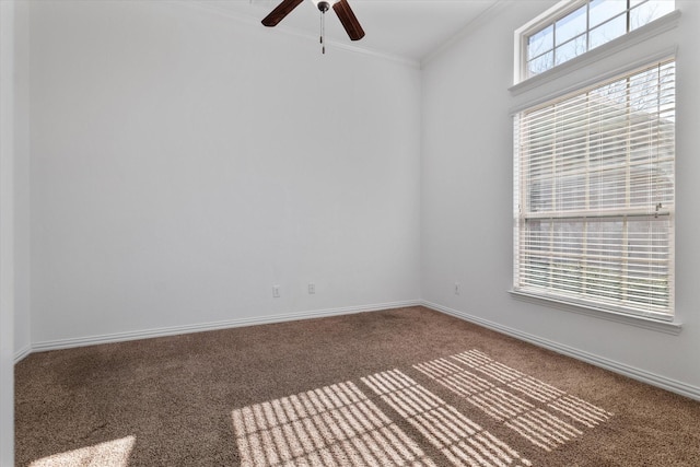 carpeted spare room with ornamental molding and ceiling fan