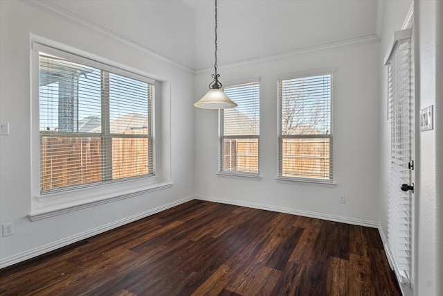 unfurnished dining area featuring crown molding and dark wood-type flooring