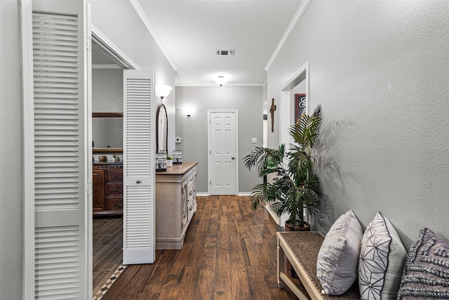 hallway with crown molding and dark hardwood / wood-style floors