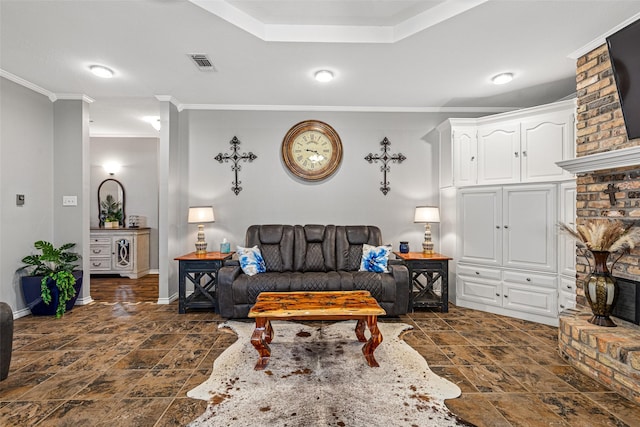 living room featuring crown molding and a fireplace