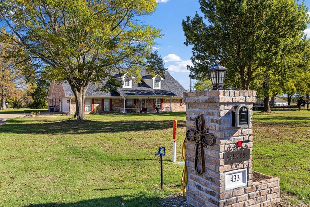 exterior space with a garage and a front lawn