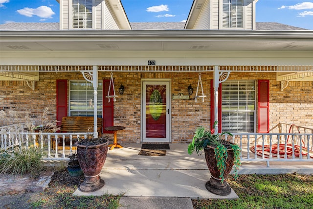 doorway to property with a porch