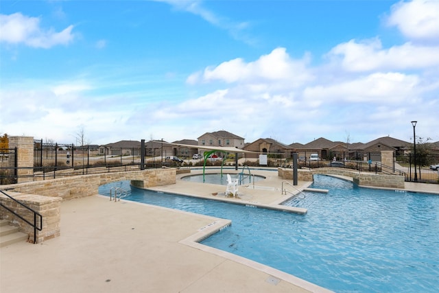 view of swimming pool featuring a patio area