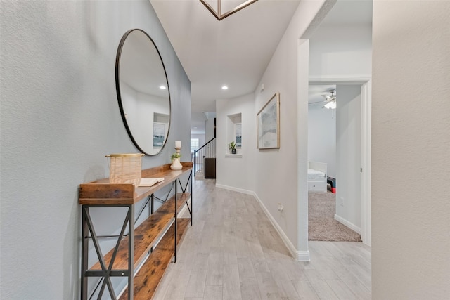 hall with light wood-type flooring