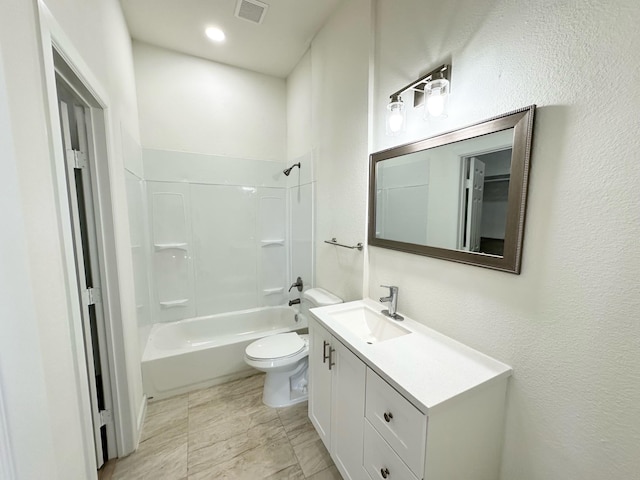 full bathroom featuring washtub / shower combination, vanity, and toilet