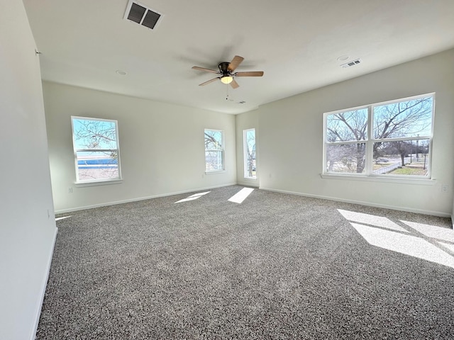 carpeted empty room featuring ceiling fan