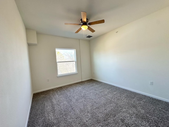 unfurnished room with ceiling fan and carpet flooring