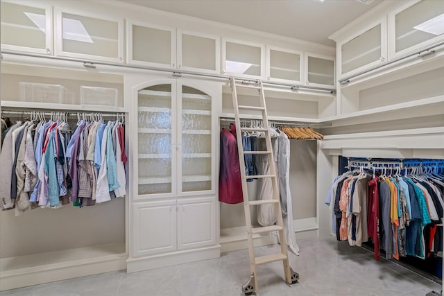 spacious closet featuring light tile patterned floors