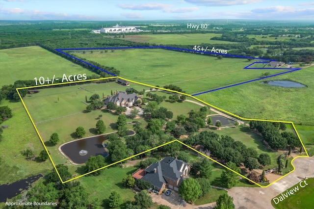 birds eye view of property with a rural view