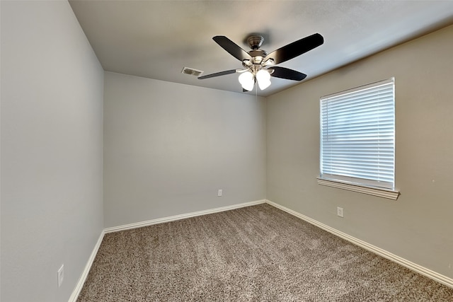 carpeted empty room featuring ceiling fan