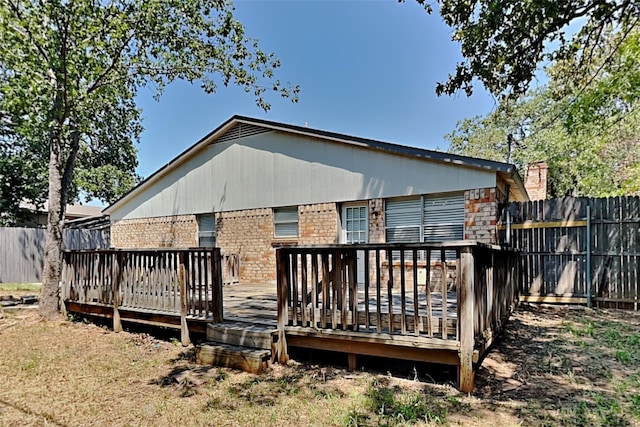 back of property with a wooden deck