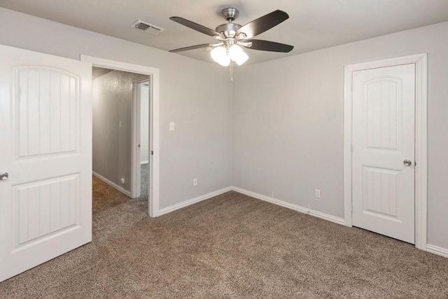 unfurnished bedroom with carpet floors, baseboards, and ceiling fan