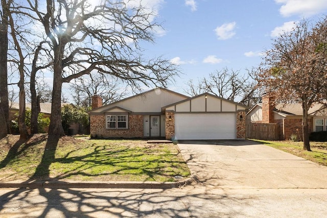 ranch-style home featuring brick siding, an attached garage, a chimney, and asphalt driveway